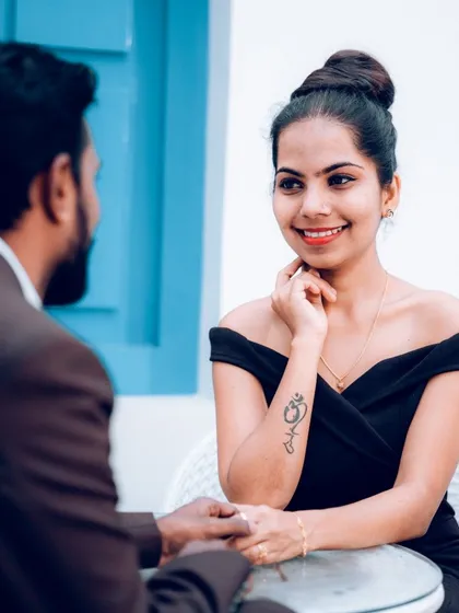 A quiet, cafe-style pre-wedding shoot. We captured the bride-to-be's adoring look, creating an intimate and personal photo that feels natural and unposed.