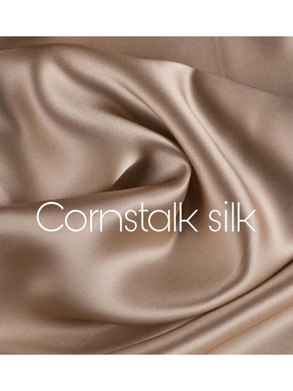 The rich, lustrous sheen of cornstalk silk. This fabric is selected for its beautiful drape and luxurious feel, forming the base of many of my most elegant and flowing creations.