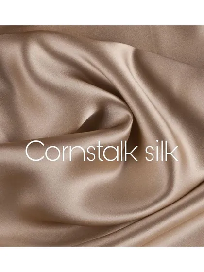 A swatch of cornstalk silk, a fabric I often use for its beautiful drape and subtle, natural sheen. The quality of the material is the foundation of every great suit.