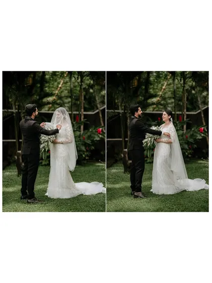 A tender moment as the groom helps his bride with her veil, a beautiful, unscripted gesture of care and love.