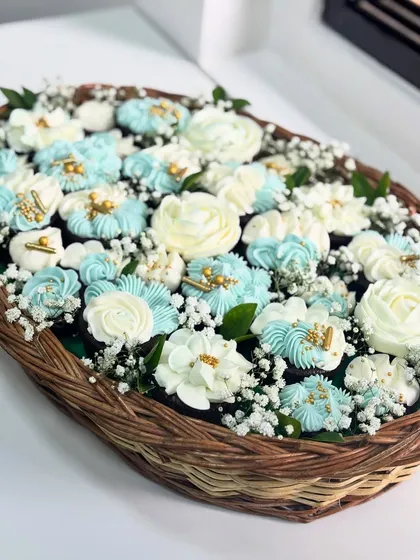 Is it a bouquet or a dessert? This is one of my favorite creations, a cupcake basket where every single flower is hand-piped with buttercream. It’s a perfect example of how I turn a simple treat into a piece of edible art, ideal for gifting.