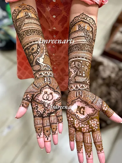 A full view of an engagement design, combining initials, rings, and peacock motifs.