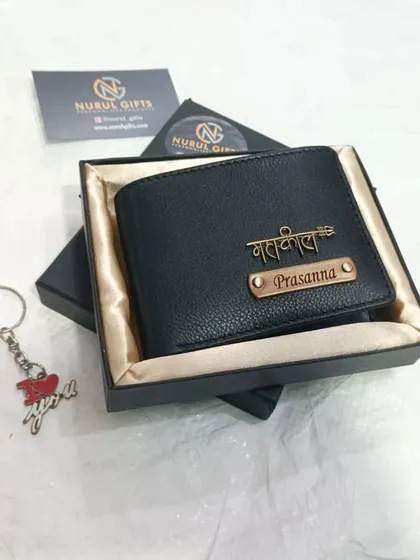 The same 'Mahakal' design on a classic black leather wallet, also paired with a special keychain for Valentine's Day.