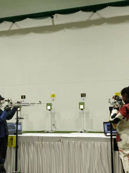 Two of our top female shooters competing head-to-head in the finals of the state championship. The intensity and focus are palpable.