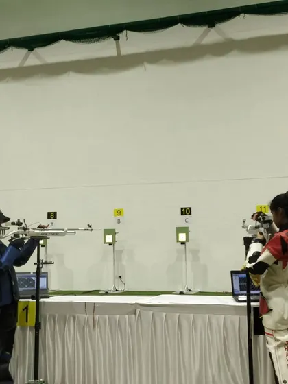 Two of our top female shooters competing head-to-head in the finals of the state championship. The intensity and focus are palpable.