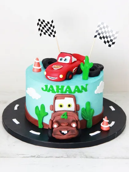 Kachow! A Lightning McQueen themed cake for Jahaan's 4th birthday, complete with his best friend Mater. The cars and desert details are all handcrafted from fondant.