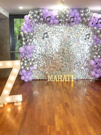 Another angle of the disco party decor, showing the light-up marquee number and personalized name sign. These details make the celebration feel extra special.