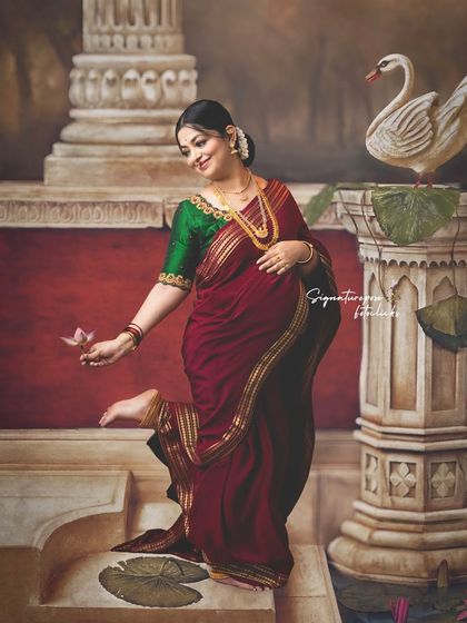 A playful and graceful pose by the painted pillar, adding a touch of movement and joy to the traditional setting.