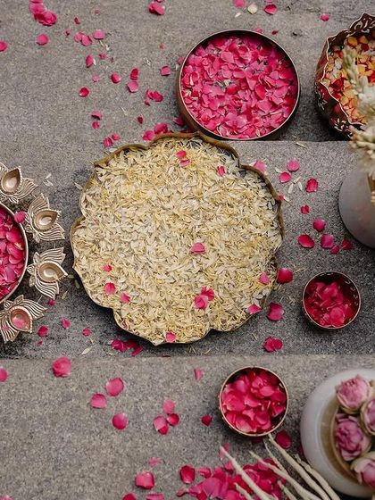 Details of a South Indian wedding ceremony. Bowls of fragrant rose petals and rice, ready for the rituals, are a beautiful and essential part of the decor.