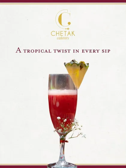 Our beverage service is designed to delight. This vibrant watermelon mocktail, garnished with a slice of fresh pineapple, offers a refreshing and elegant start to any event, perfect for welcoming guests.