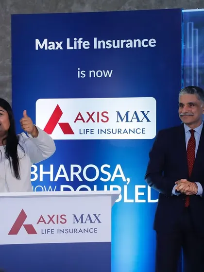 An energetic moment on stage during the 'Double Bharosa' celebration for Axis Max Life Insurance.