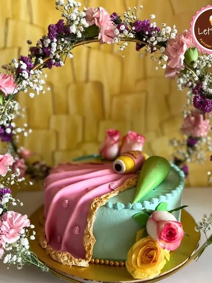 For moments that deserve something truly extraordinary, I craft custom cakes like this elegant floral creation. This piece, designed for a special celebration, features delicate fondant work and a beautiful arch of fresh flowers, showing how I can turn your dream cake into a stunning reality.