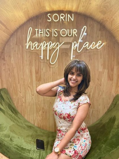 A client looking glamorous and happy with her new hairstyle, perfectly capturing the essence of the Sorin experience.