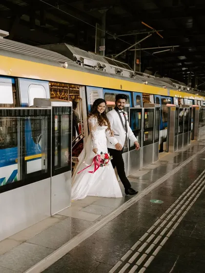 Love stories unfold in the most unexpected places. For this couple's post-ceremony shoot, we took to the Mumbai metro, creating a series of modern, unconventional portraits that reflect their fun-loving spirit against an everyday urban backdrop.