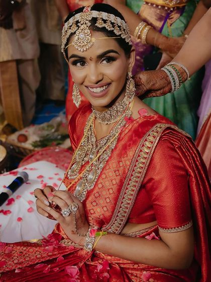 For her South Indian ceremony, Manisha did a quick change into this classic red Sabya saree. It was a gift from her mother-in-law and looked absolutely radiant on her.