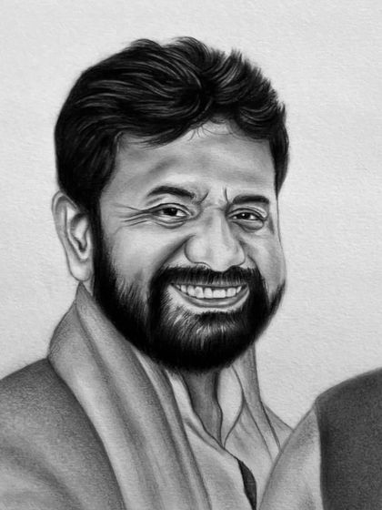 A close-up of the charcoal portrait of C.T. Ravi, showing the detail in the beard and the cheerful expression.