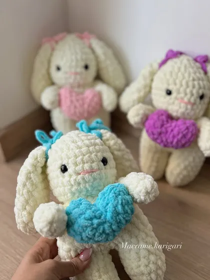 Our collection of Amigurumi bunnies, each holding a colorful heart. These are one of our most requested items for baby showers and birthday gifts.