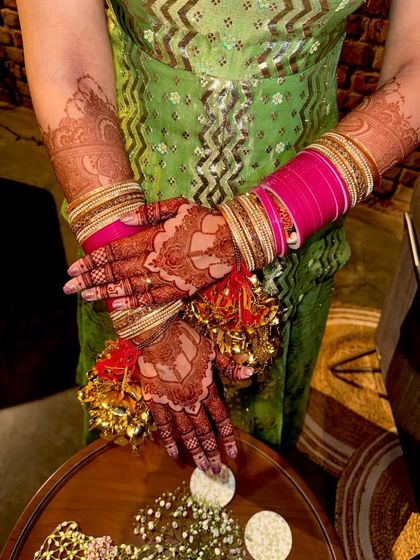 Another view of the bride's hands, showing her beautiful kalire and the rich mehendi color.