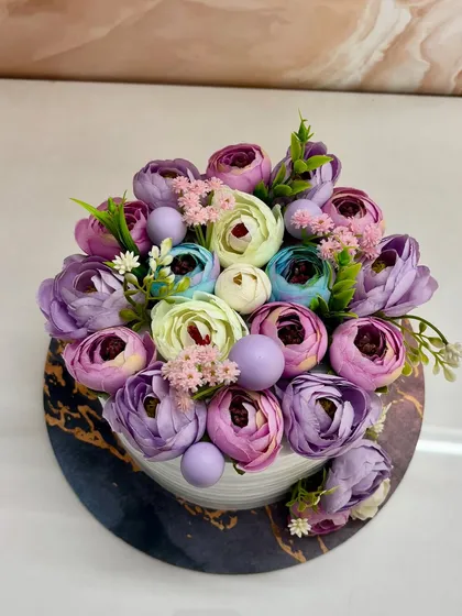 A top-down view of the edible flower garden cake.