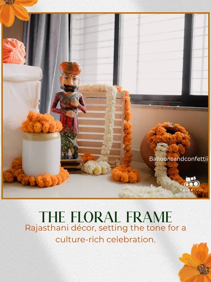 Details matter. This corner features a Rajasthani-style wooden figurine, marigold arrangements in earthen pots, and garlands of fresh flowers, all coming together to create a culturally rich and authentic vibe for the celebration.