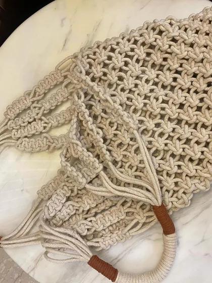 A detailed shot of the knotting on my macrame market bag. The open-weave design is sturdy and flexible.