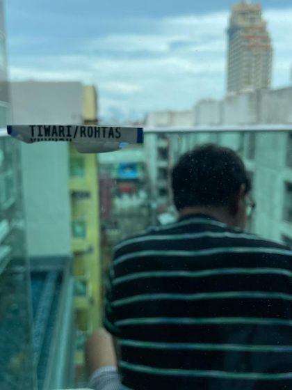 A client enjoying the view from their high rise apartment balcony. My goal is to find you a home where you can relax and take in the Bangalore cityscape.