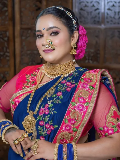 A detailed shot of the eye makeup and the traditional crescent bindi, key elements of a Maharashtrian look.