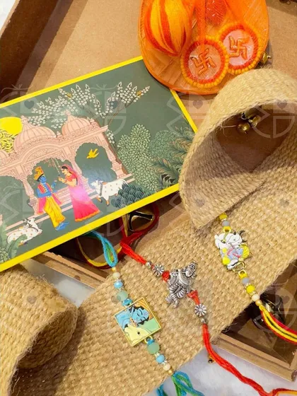 A glimpse of my Rakhi collection, featuring 'rakhis' with traditional Indian art motifs, presented in a rustic jute box.