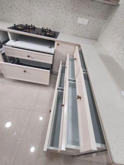 This image shows the deep, vertical pull-out drawers, perfect for storing bottles and other tall items, ensuring everything has its place.