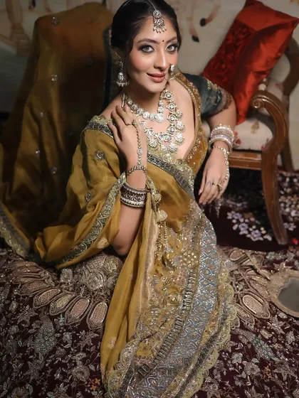 A beautiful portrait of the bride, her makeup looking soft and romantic in this setting.