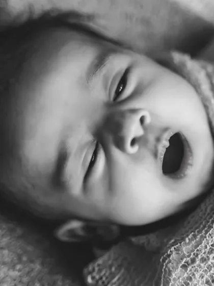Sometimes the most simple moments are the most beautiful. This black and white close-up of a yawning newborn captures the pure, unfiltered emotion of those early days.