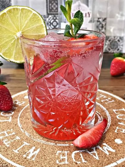 A refreshing Strawberry Mojito, perfect for a summer event. This drink is made with fresh strawberries, mint, and lime, creating a beautiful red hue and a crisp, delicious taste.