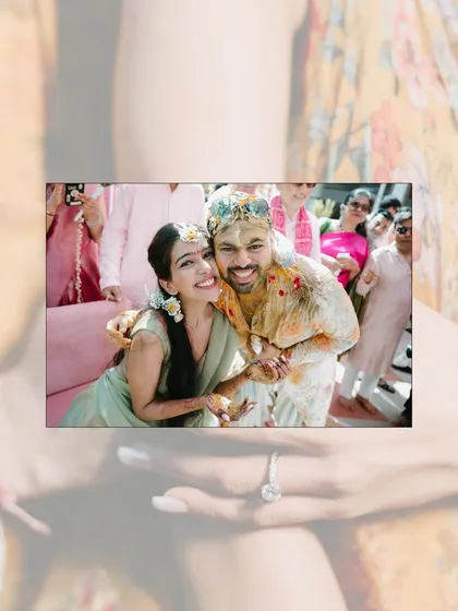 A fun and candid shot of the couple covered in haldi, smiling and embracing, capturing the playful spirit of the ceremony.