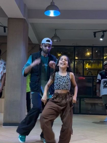 A student enjoying the 'You and Me' workshop. This feel-good Bollywood track is all about simple, happy moves and dancing with a smile.