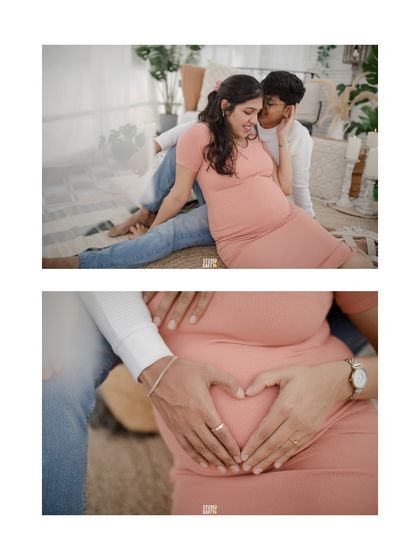 A close-up of the couple's hands forming a heart on the baby bump, a classic and heartfelt symbol of their love.