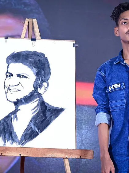 This is my tribute to the legend, Puneeth Rajkumar. Creating portraits of beloved icons live on stage is my way of honoring their legacy and sharing that moment with the audience. It's a powerful experience for everyone involved.
