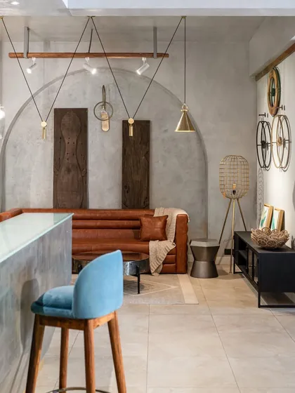 A reception or bar area in a retail setting, where different materials and lighting styles are choreographed to create a specific mood.