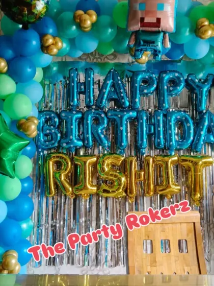 A Minecraft-themed birthday decoration. I used blue and green balloons to match the game's aesthetic, along with a character foil balloon.