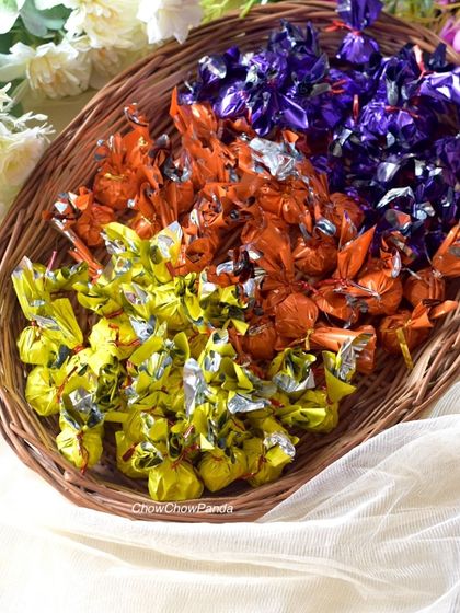 A slightly different angle of the basket of chocolates, highlighting the vibrant colours of the foil wrappers.