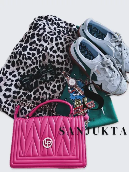 This flat lay is all about a fun weekend outfit. I've mixed a bold leopard print with a graphic tee and added a pop of bright pink with a quilted bag for a look that is casual, chic, and full of personality.