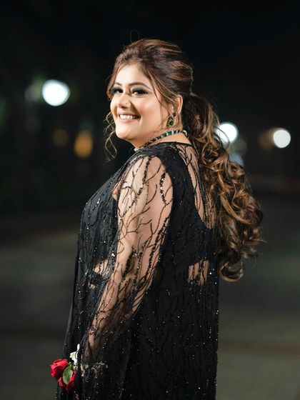 A happy shot of Ishita at her cocktail party. The classic black smokey eye and nude lip combo is timeless and chic.