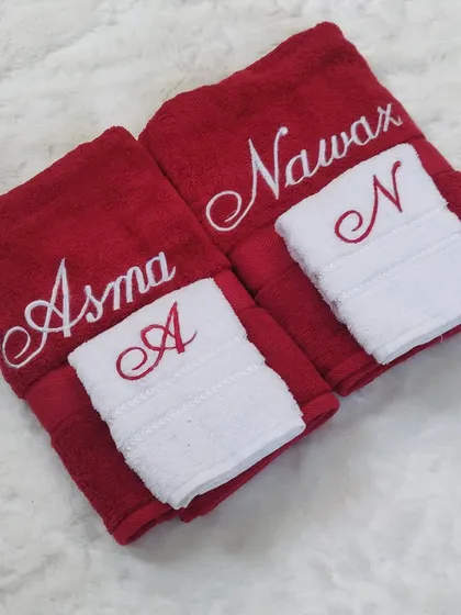 This red and white towel set is so striking and romantic. I made this for a soon-to-be couple, with their names embroidered on the red bath towels and their initials on the contrasting white hand towels.