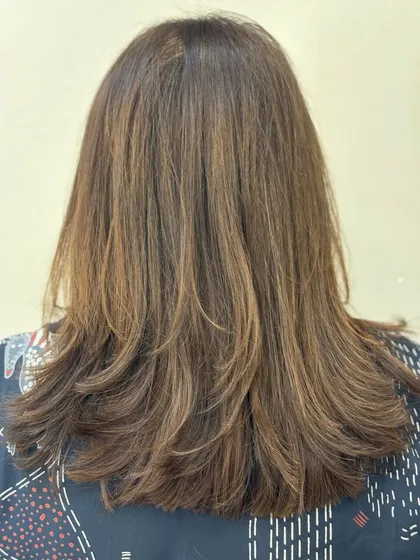 The back view of a precision-layered haircut. You can see how the layers are stacked to create shape and texture.