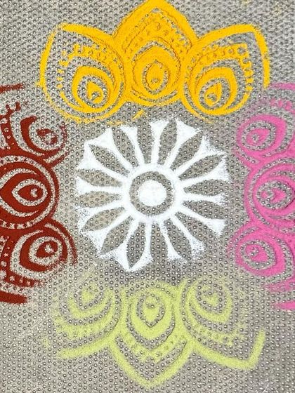 A vibrant Rangoli design made with natural powders. This traditional art form is a beautiful way to express creativity and celebrate our cultural heritage.