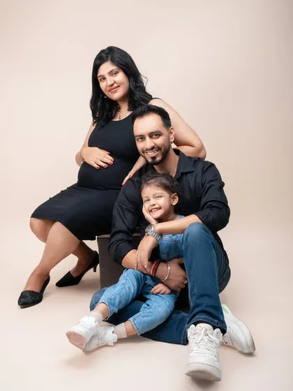 A picture perfect moment before a family of three becomes four. This portrait is all about capturing the love, laughter, and anticipation that fills a home when a new life is on the way.
