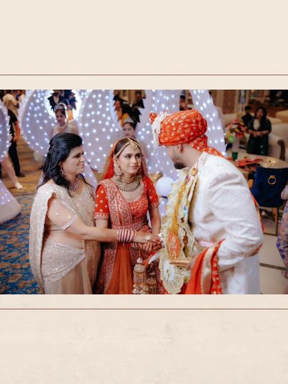 A touching moment between the bride, her mother, and the groom during the wedding ceremony.