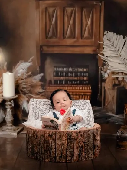 A different perspective from our library-themed session, this time with a rustic fireplace backdrop. I can adjust the setup to create a variety of beautiful images from a single themed concept.