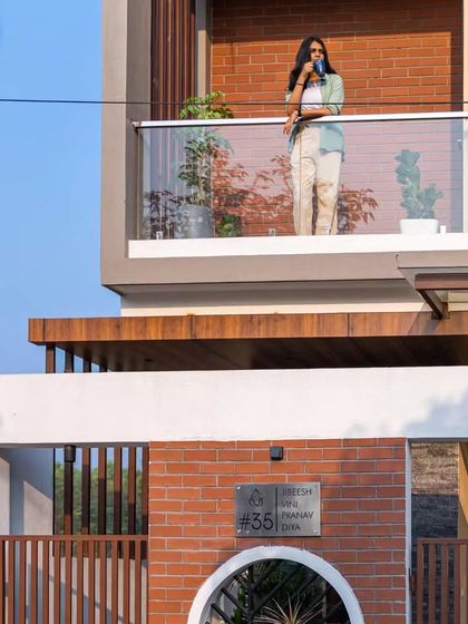 A close-up view of the balcony and compound wall detail at the Sarjapur residence.