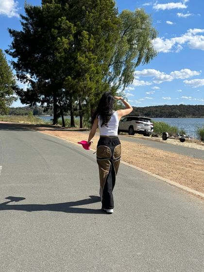 Wearing a pair of my custom wide-leg pants with contrasting pocket details. I design my streetwear to be both functional for everyday life and visually distinct.