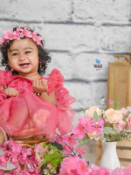 A duplicate of image 90, this happy girl is all smiles during her pink-themed birthday session.